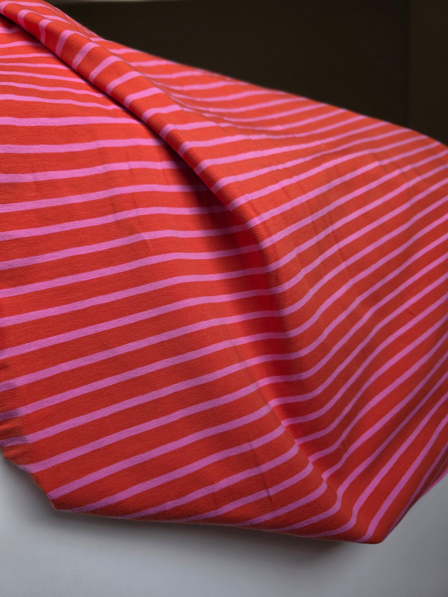Tissu jersey ligné - rose/orange