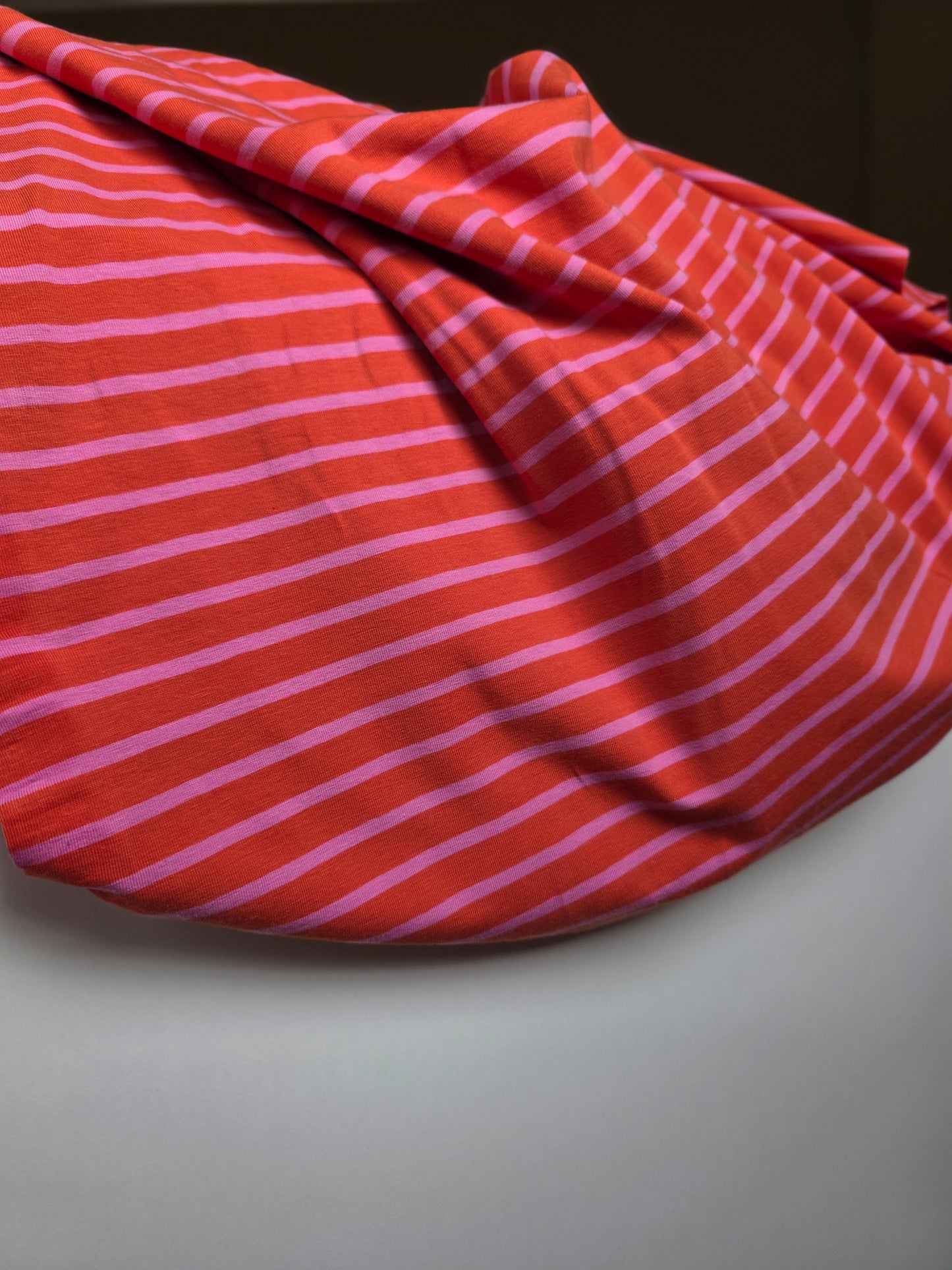 Tissu jersey ligné - rose/orange