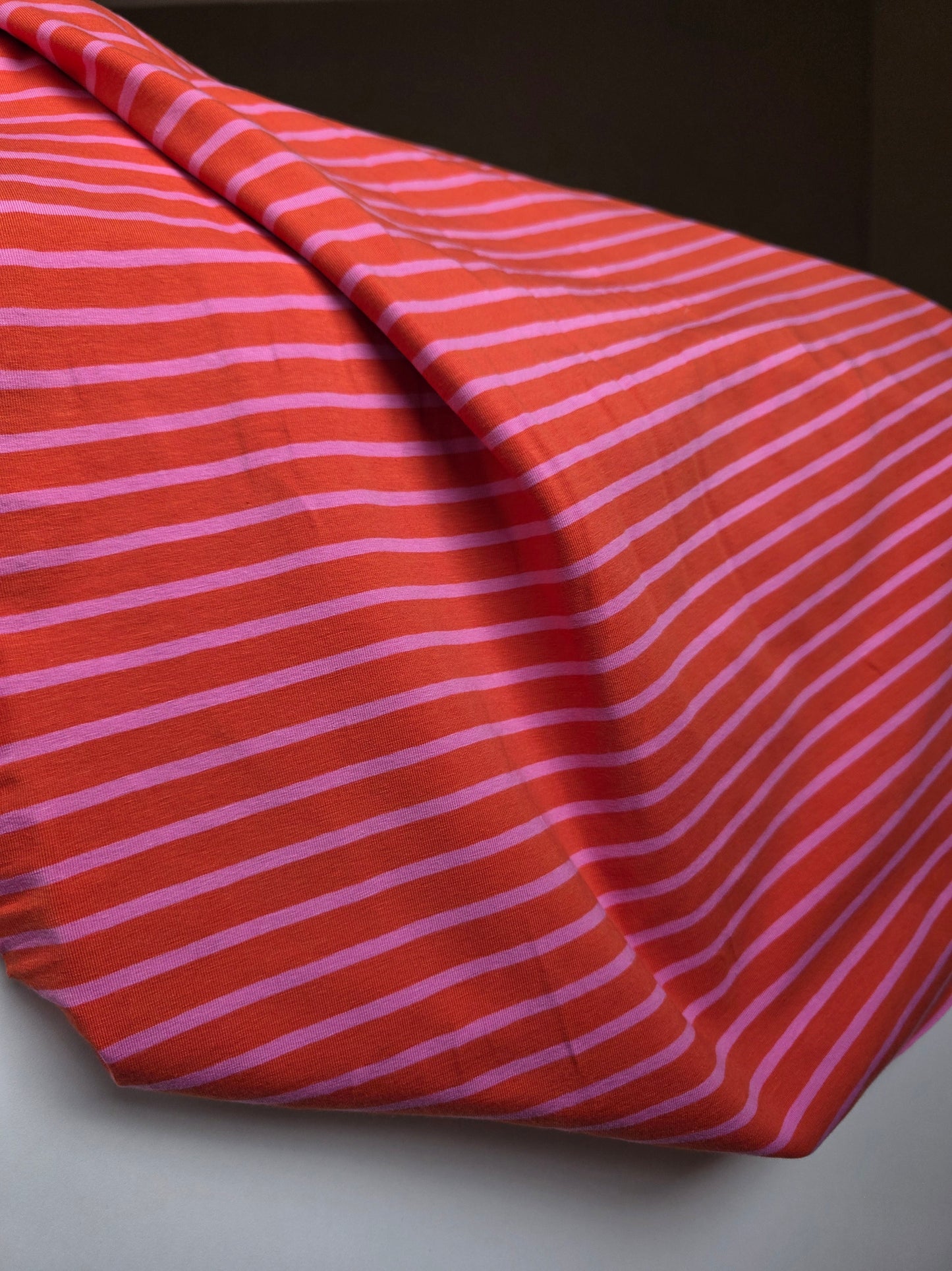 Tissu jersey ligné - rose/orange